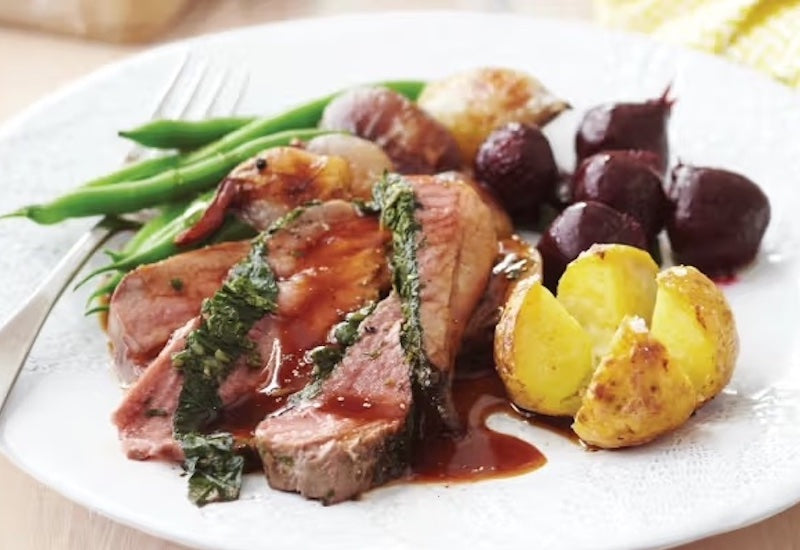 Herb stuffed butterflied leg of lamb